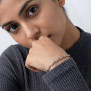Twisted dual tone bracelet with intertwined gold and silver chains