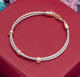 Silver Woven Cord Bracelet with Rose Gold Pave Barrel Charms