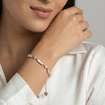 Rose gold bracelet with pearl bar details and crystal accents