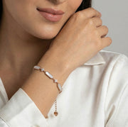 Rose gold bracelet with pearl bar details and crystal accents