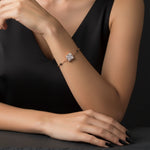 Elegant rose gold bracelet with black bead chain and sparkling geometric crystal centrepiece on a minimal adjustable design.
