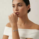 Elegant butterfly and evil eye bracelet with sparkling crystal details and fine chain design
