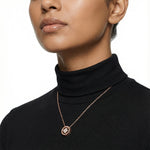 Rose gold clover pendant necklace with sparkling crystal details and elegant circular charm design for women