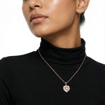 Blush pink heart halo pendant necklace with crystal accents and rose gold finish for women

