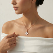 Elegant rose gold Luna clover spark necklace with crystal halo pendant and delicate chain
