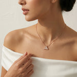 Rose gold triangle pendant necklace with sparkling crystal detailing on a delicate chain
