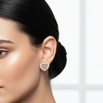 Blush heart halo stud earrings with pink crystal center stones and sparkling round crystal border in rose gold finish.
