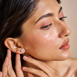 Blush heart halo stud earrings with pink crystal centre stones and sparkling round crystal border in rose gold finish.
