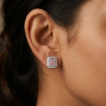 Square halo stud earrings with pink baguette stones and sparkling crystal border in silver finish.
