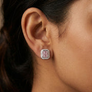 Square halo stud earrings with pink baguette stones and sparkling crystal border in silver finish.

