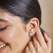 Luxury crystal blossom stud earrings with floral design and sparkling stones in polished silver finish for women
