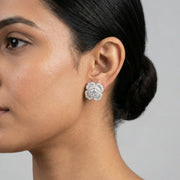 Radiant floral crystal stud earrings with sparkling halo design and elegant white stones for women’s luxury fashion jewelry.

