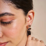 Rose gold midnight oval drop earrings with black crystal stones and elegant luxury design
