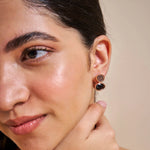 Rose gold midnight oval drop earrings with black crystal stones and elegant luxury design
