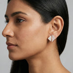 Rose gold geometric pearl stud earrings with crystal accents and modern triangular design for women.
