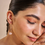 Rose gold hoop earrings with round crystal pave disc design for elegant party and everyday wear.
