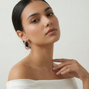 Rose gold crystal bar hoop earrings with modern geometric detailing and sparkling stones for women
