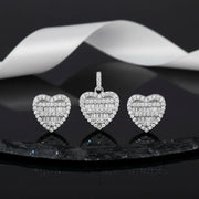 Crystal heart halo jewellery set with sparkling baguette stones featuring matching pendant and stud earrings in silver finish.
