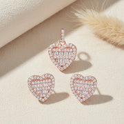 Rose gold heart crystal pendant necklace with matching heart stud earrings featuring baguette and halo stones