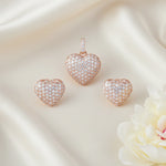 Rose gold heart crystal pendant and matching stud earrings jewellery set with sparkling pave stones
