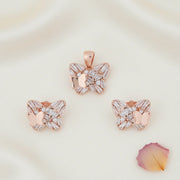 Rose gold butterfly pendant and earrings jewellery set with sparkling crystal stones and elegant luxury design.
