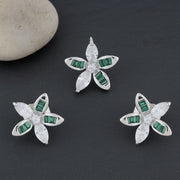 Emerald green and white crystal floral stud earrings with sparkling stones in a silver finish luxury jewellery design.
