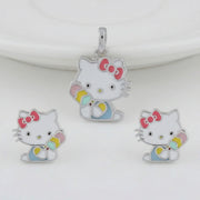 Cute kitty enamel jewellery set with colourful bow pendant and matching stud earrings on white background
