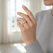 Rose gold baguette crystal band ring with textured design and sparkling stone accents for women
