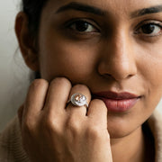 Luxury champagne crystal halo ring with baguette stones and silver finish for women’s statement jewellery styling.

