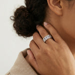 Rainbow baguette eternity ring with multicolour crystal stones and sparkling pave accents in a sleek silver finish.
