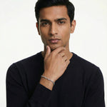 Minimal silver helix link bracelet with twisted geometric chain design and polished finish
