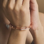 Rose gold pave link bracelet with elongated chain links and sparkling crystal accents
