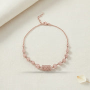 Elegant rose gold mesh bead bracelet with textured round beads and geometric centrepiece
