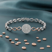 Dual tone circle bracelet with sparkling pave centrepiece and elegant linked chain design for women
