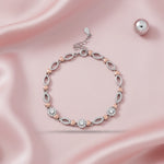 Dual-tone heart link bracelet with sparkling crystal circles and elegant adjustable chain design for women