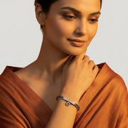 Rose gold open cuff bracelet with blue crystal inlay and sparkling pave centre design
