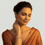 Rose gold open cuff bracelet with hexagon bead detailing and crystal pave accents
