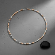Modern dual tone bar necklace with rose gold and silver textured links in a sleek polished finish
