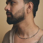 Modern geometric silver-tone link necklace with angular polished chain design for women’s fashion jewellery.

