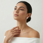 Rose gold pearl wing earrings with sparkling crystal accents and elegant modern design for women
