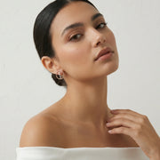 Elegant rose gold circular stud earrings with crystal detailing for women
