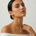 Rose gold panther drop earrings with sleek animal head design and polished hoop detailing for women’s fashion jewelry.
