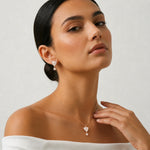 Rose gold triangle pearl pendant and earrings set with crystal drop accents
