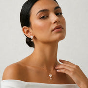 Rose gold triangle pearl pendant and earrings set with crystal drop accents
