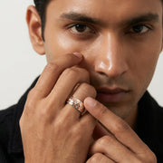 Elegant rose gold dome ring with embedded crystal accents and polished silver inner band isolated
