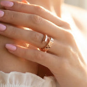 Rose gold nail inspired crystal ring with modern wrap design and sparkling stone accents for women’s fashion jewellery.
