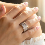 Luxury layered crystal baguette ring with shimmering stones and polished silver-tone finish for women.
