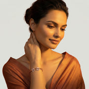 Rose gold square link bracelet with crystal pave accents and modern twisted chain design for women
