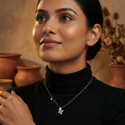 Rose gold butterfly drop pendant necklace with crystal detailing and elegant minimalist chain design for women
