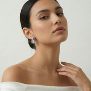 Elegant sky blue square crystal drop earrings with polished silver-tone finish and sparkling geometric design for women.
